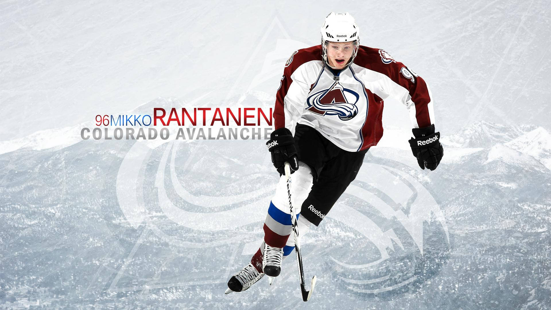 Mikko Rantanen Crossed Legs While Skating And Holding Hockey Stick Background