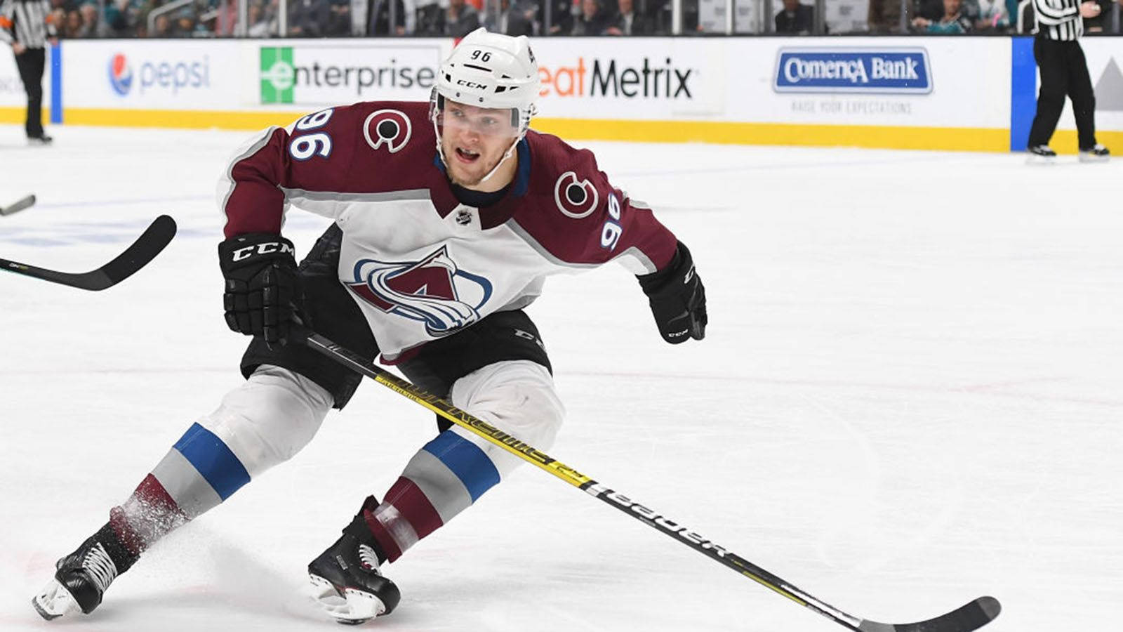 Mikko Rantanen Leaning To The Left And Holding Hockey Stick With Right Hand Background