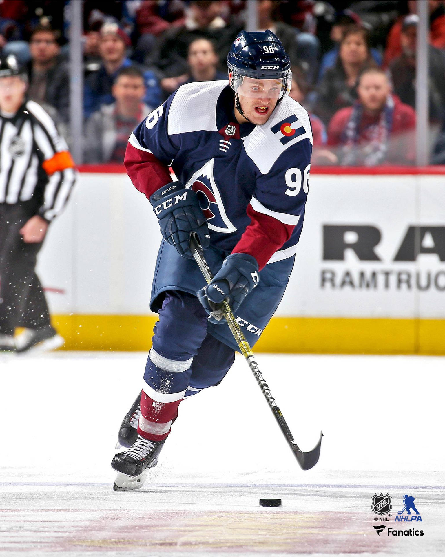 Mikko Rantanen Skillfully Dribbling A Hockey Puck During A Game Background