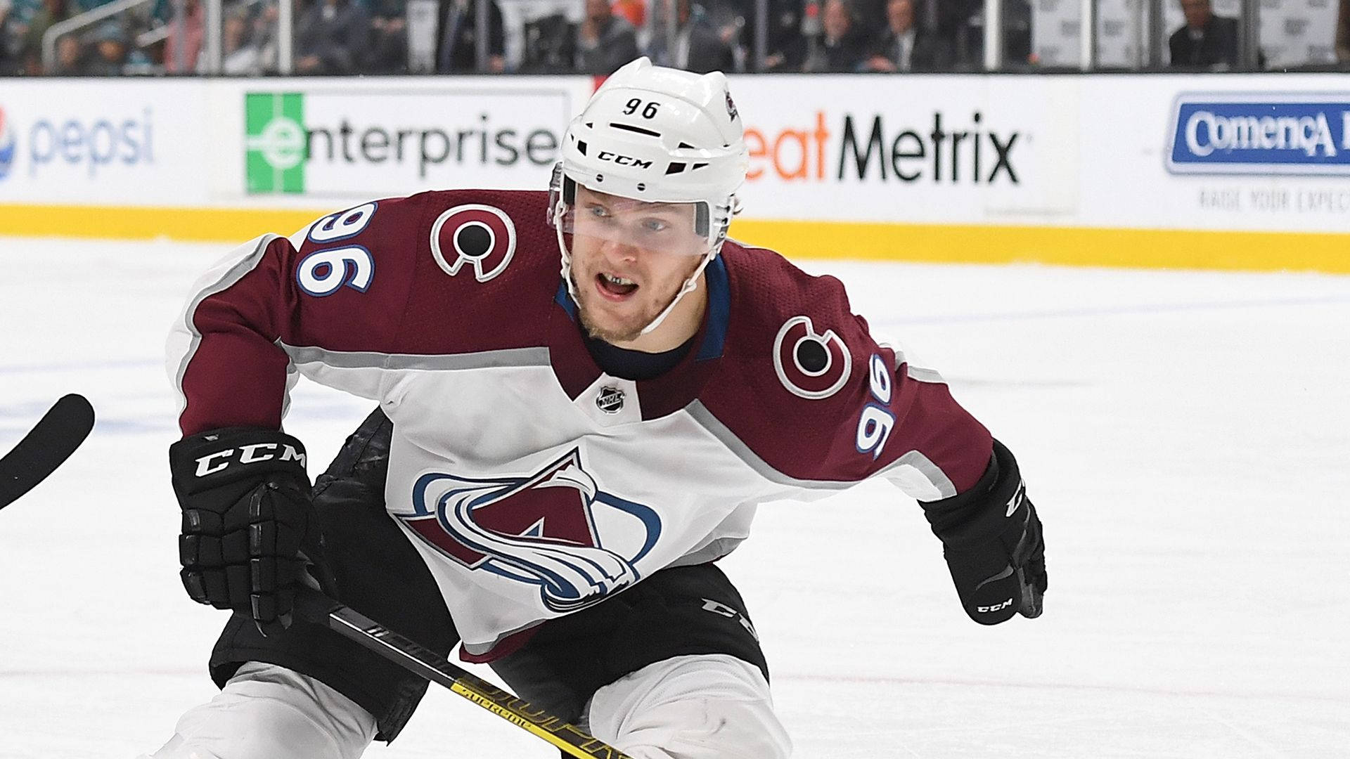 Mikko Rantanen With Mouth Open Holding Hockey Stick Background