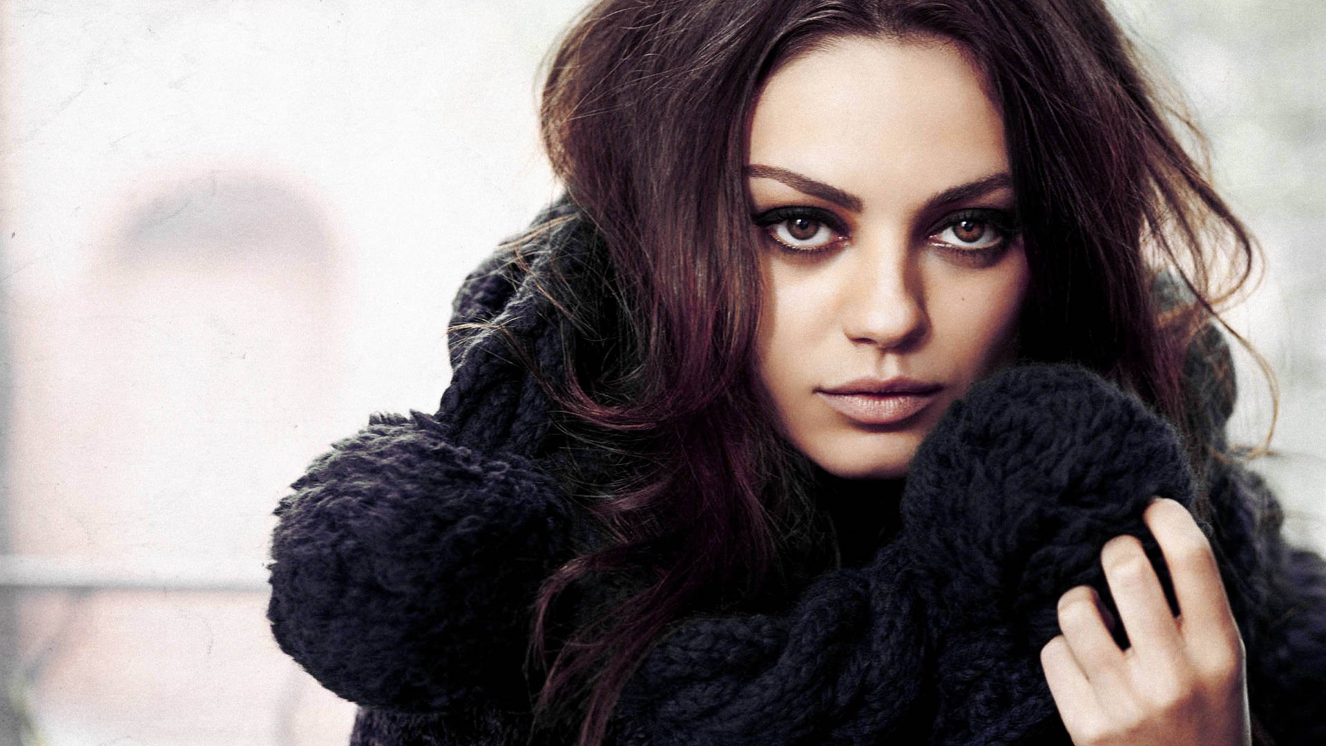 Mila Kunis: Hollywood’s Enigmatic Beauty Background