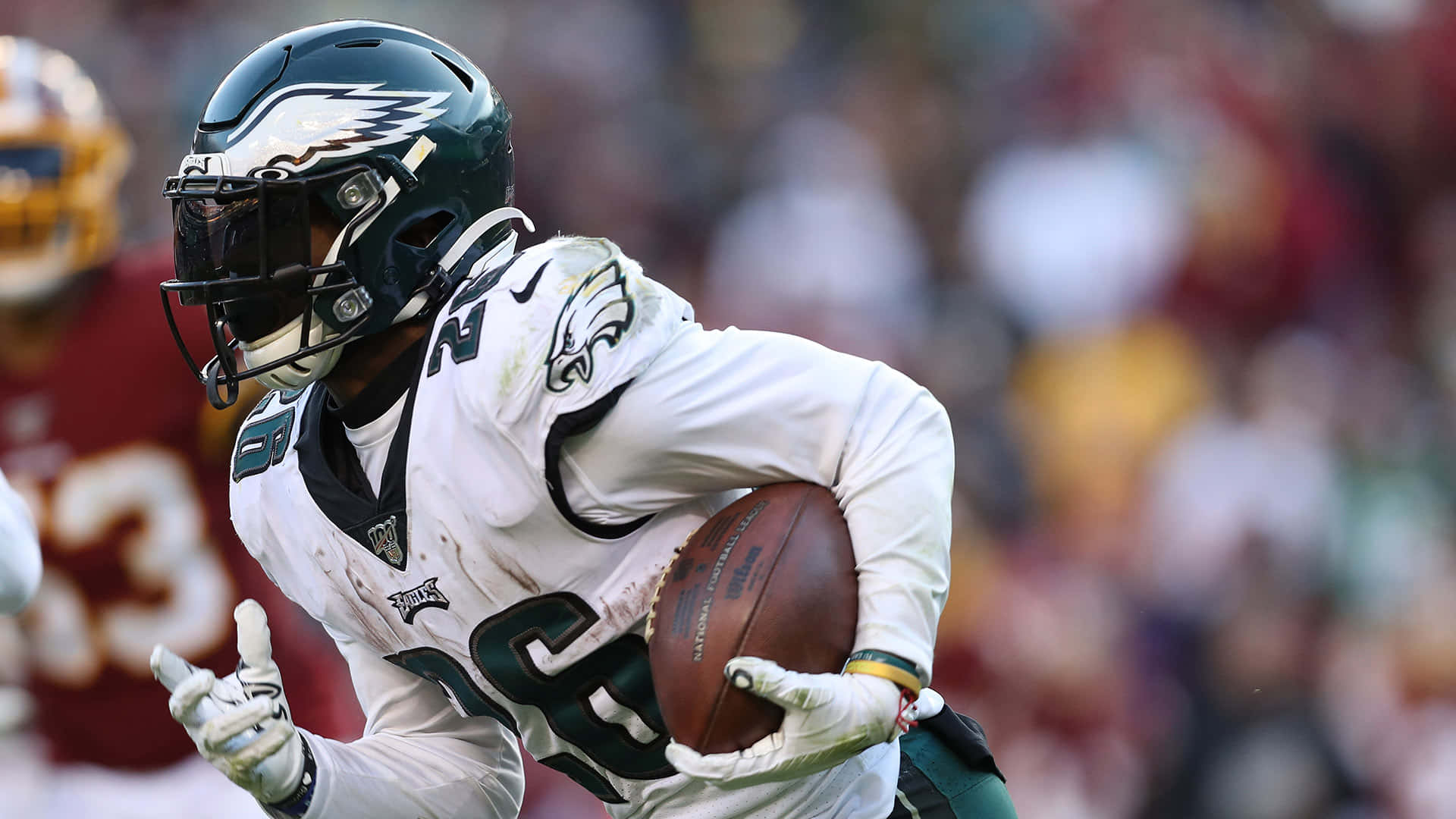 Miles Sanders Running With Ball Background