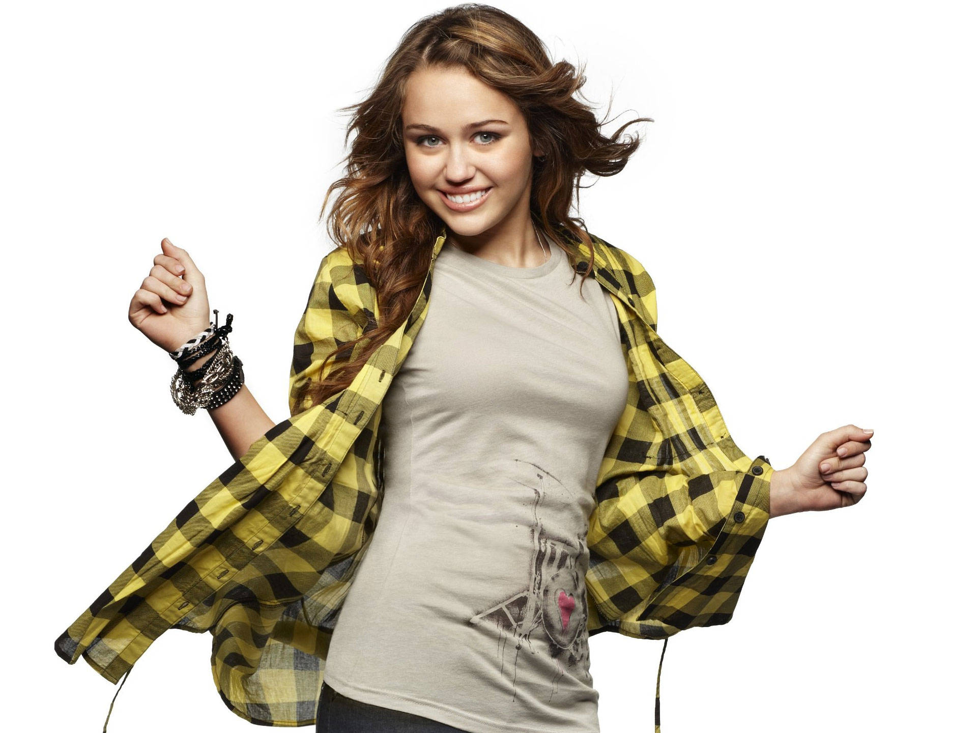Miley Cyrus Shines In A Bright Yellow Flannel Background