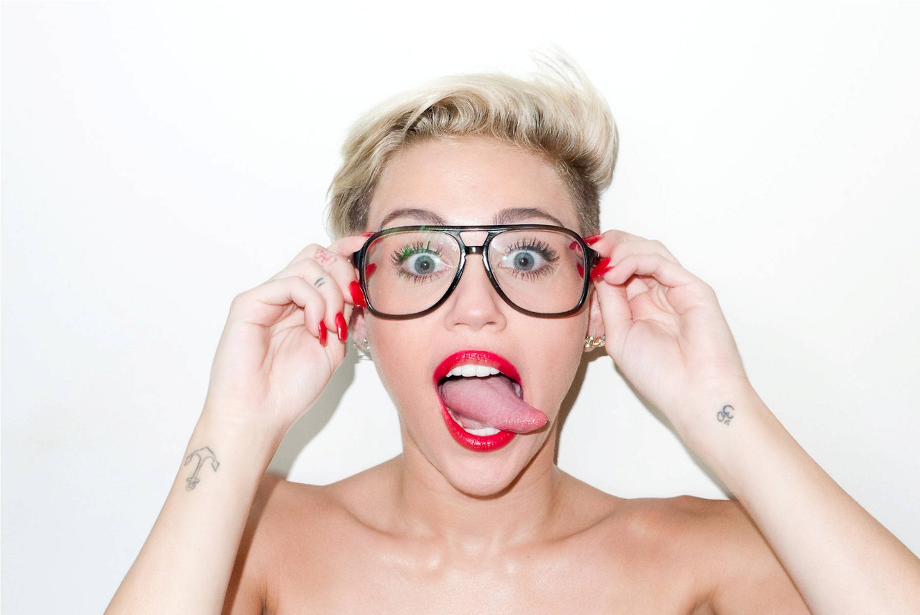 Miley Cyrus Showing Her Goofy Side Background
