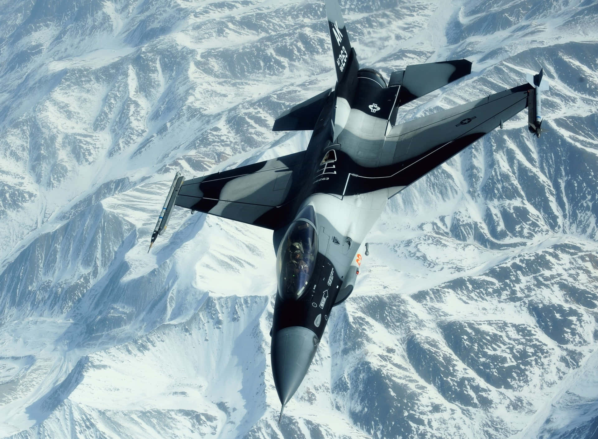 Military Plane On Snowy Mountains Background