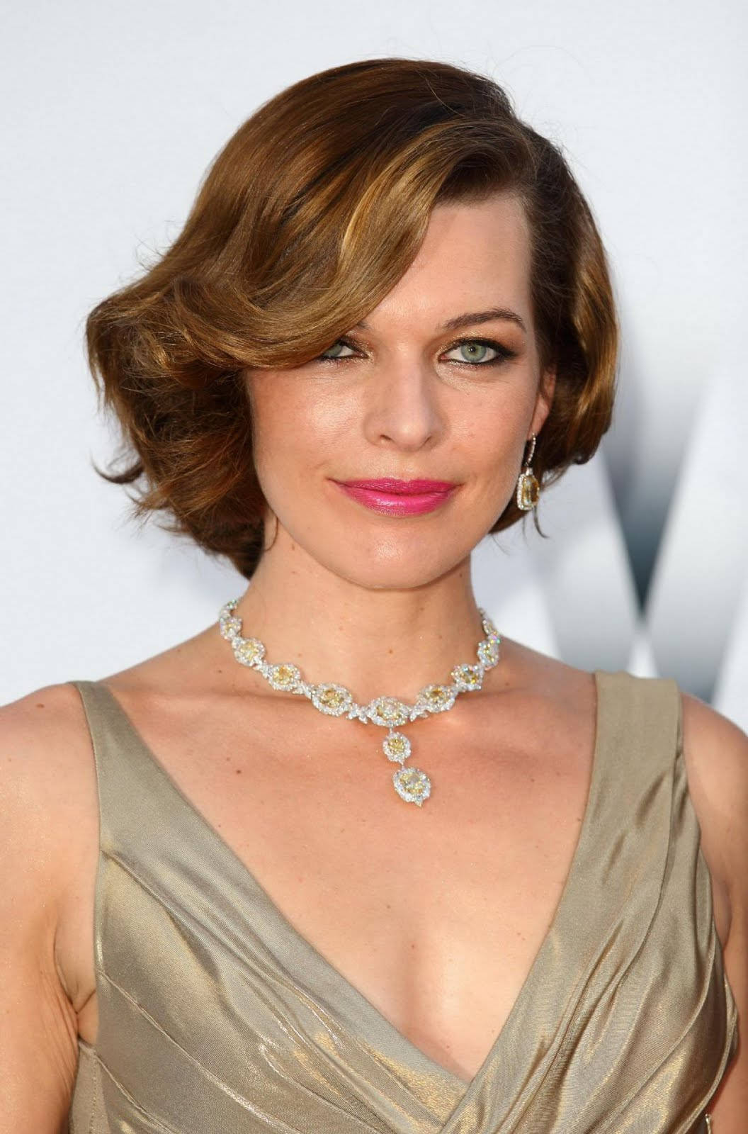 Milla Jovovich Alluring Gown Red Carpet Background