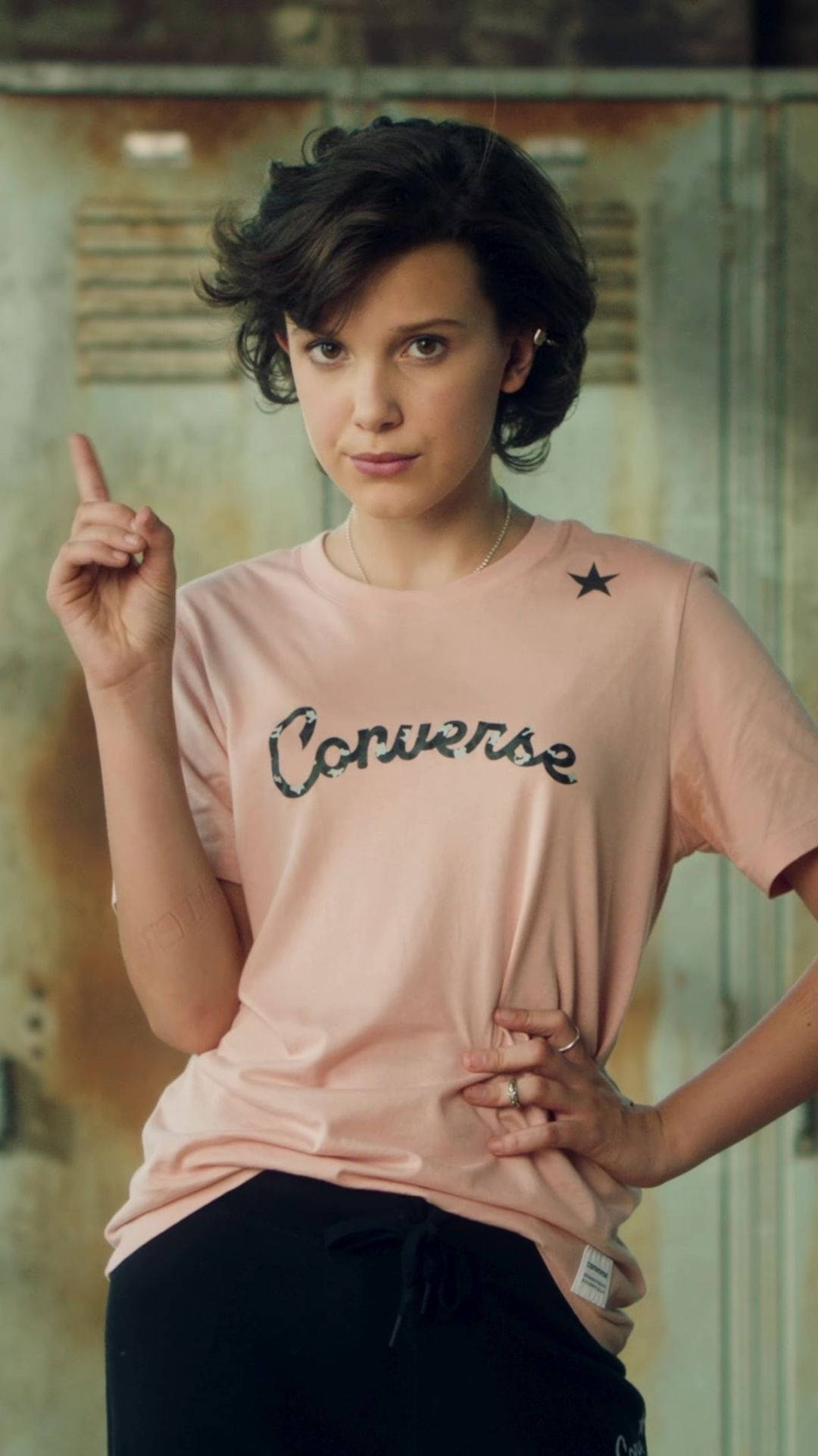 Millie Bobby Brown In A Casual Converse Shirt Background