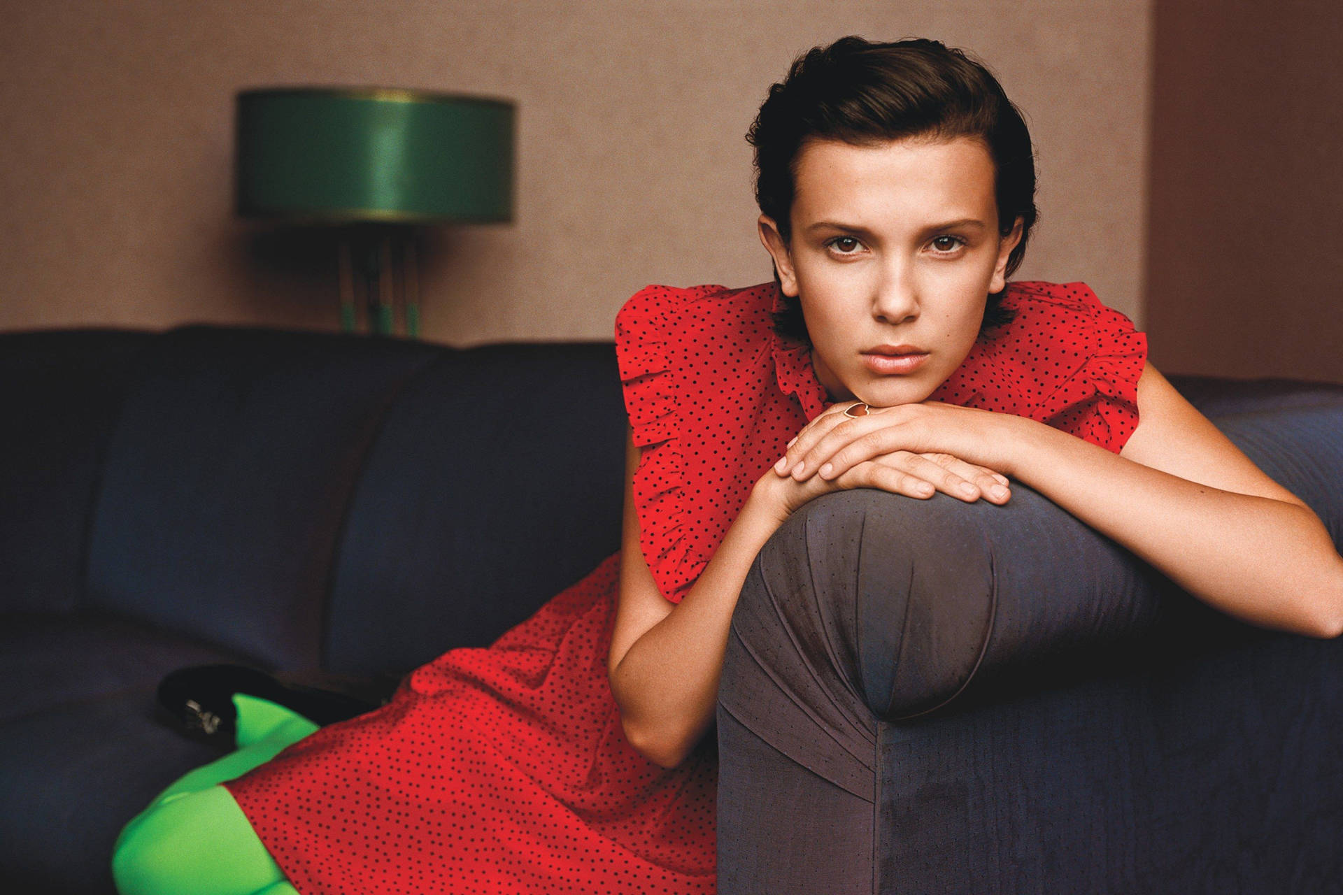 Millie Bobby Brown Looking Regal In A Red Dress Background