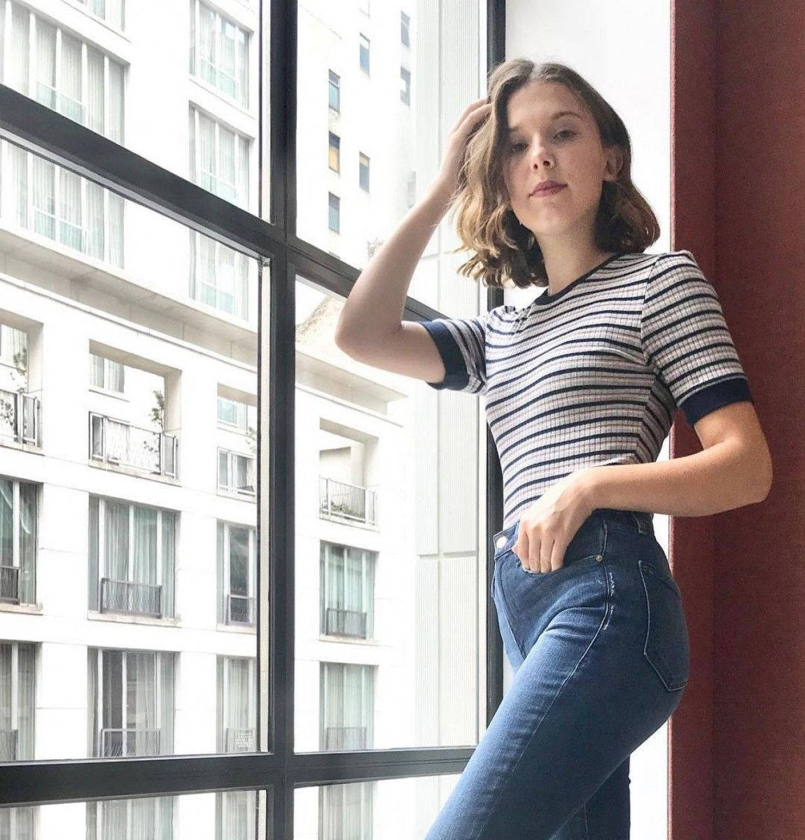 Millie Bobby Brown Rocking A Cool And Casual Look. Background