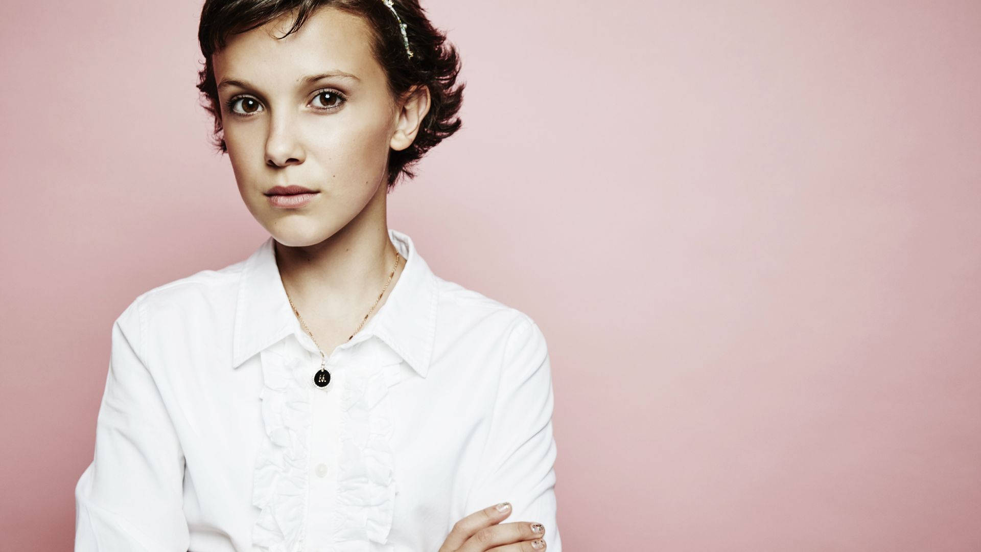 Millie Bobby Brown Showing Off A Fierce Look Background