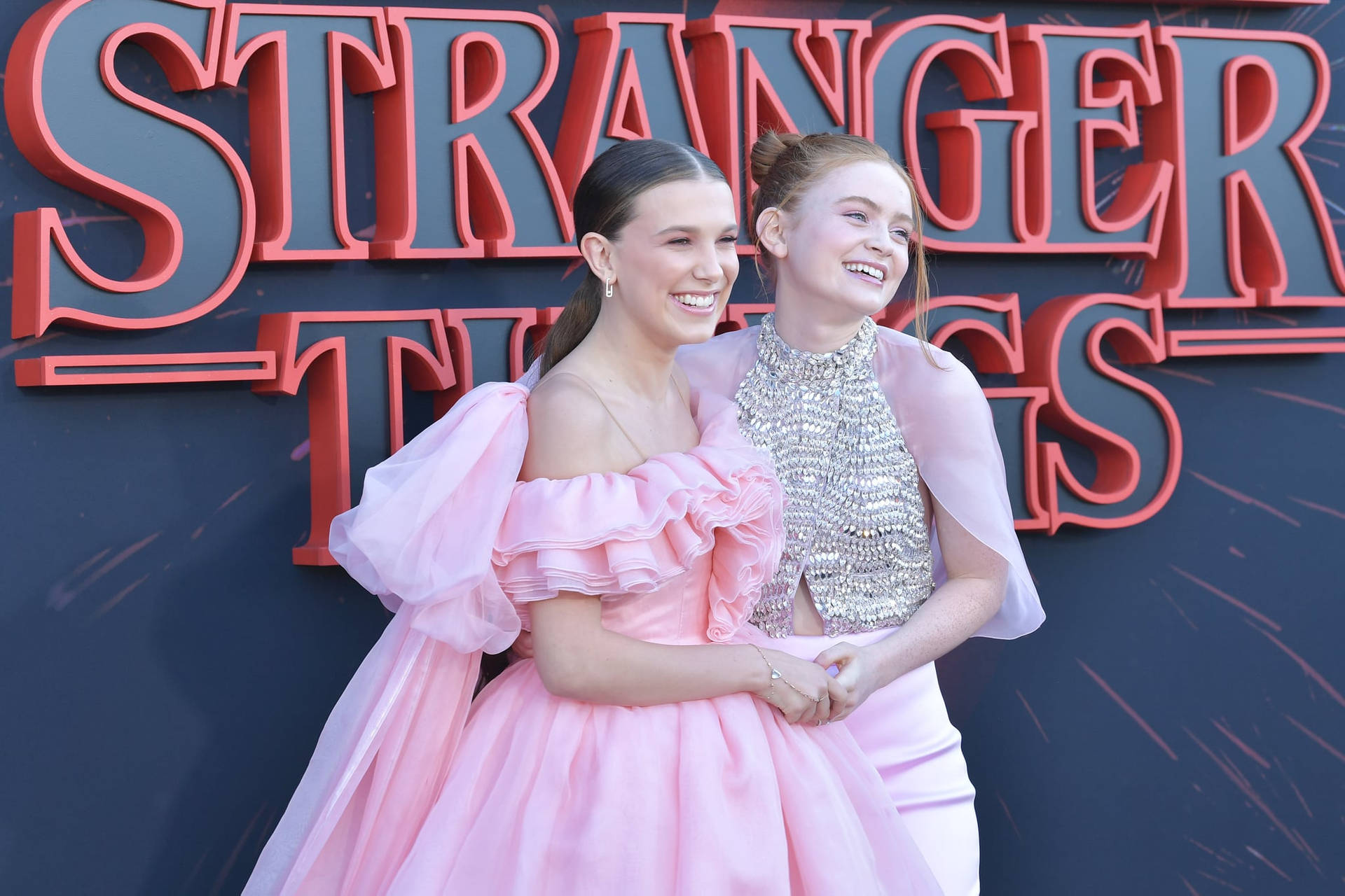 Milly Bobby Brown And Sadie Sink Background