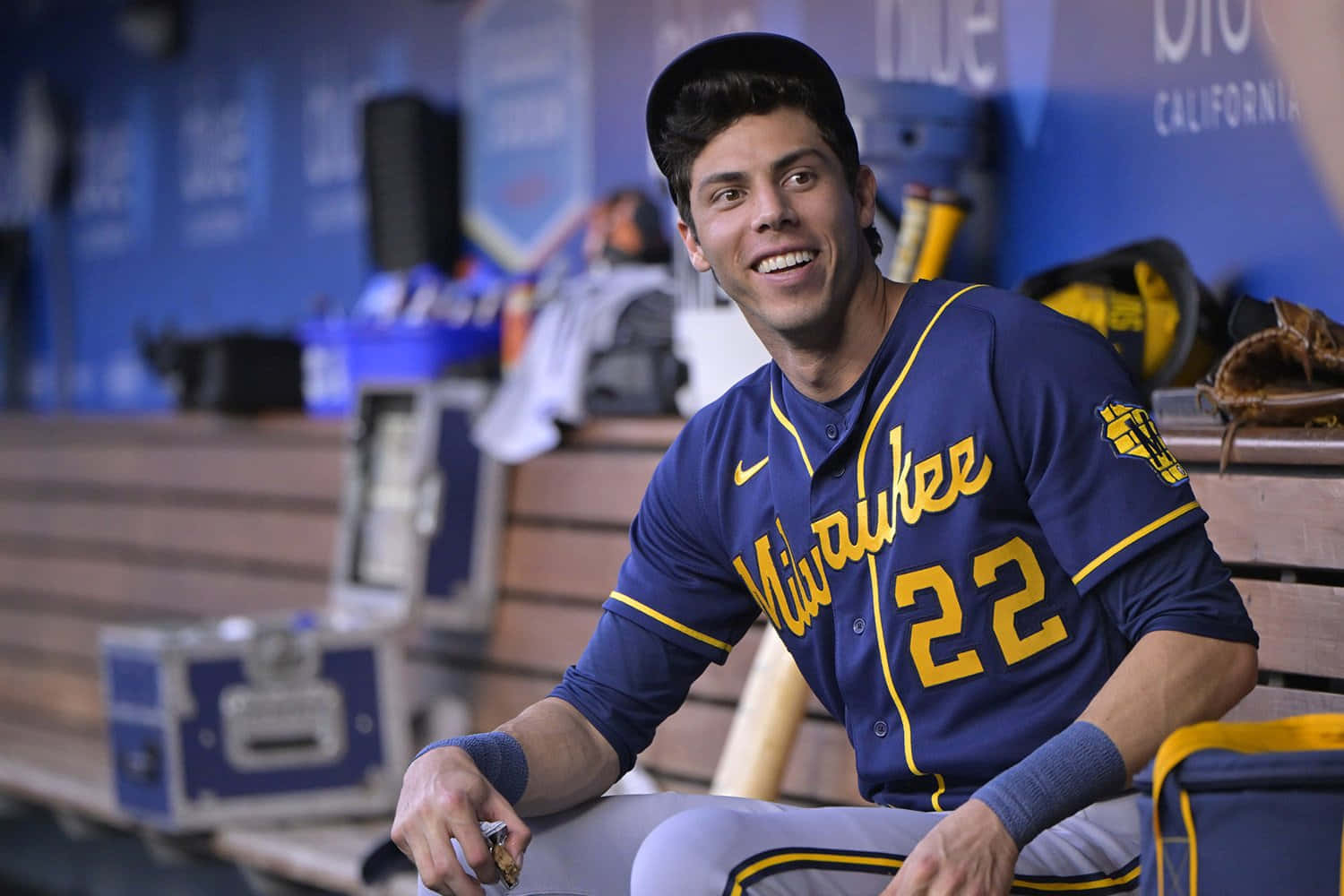 Milwaukee Baseball Player Smiling Dugout Background