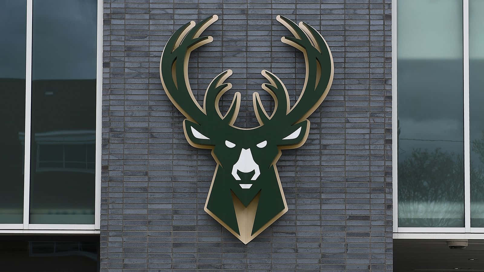 Milwaukee Bucks Logo On The Side Of A Building Background