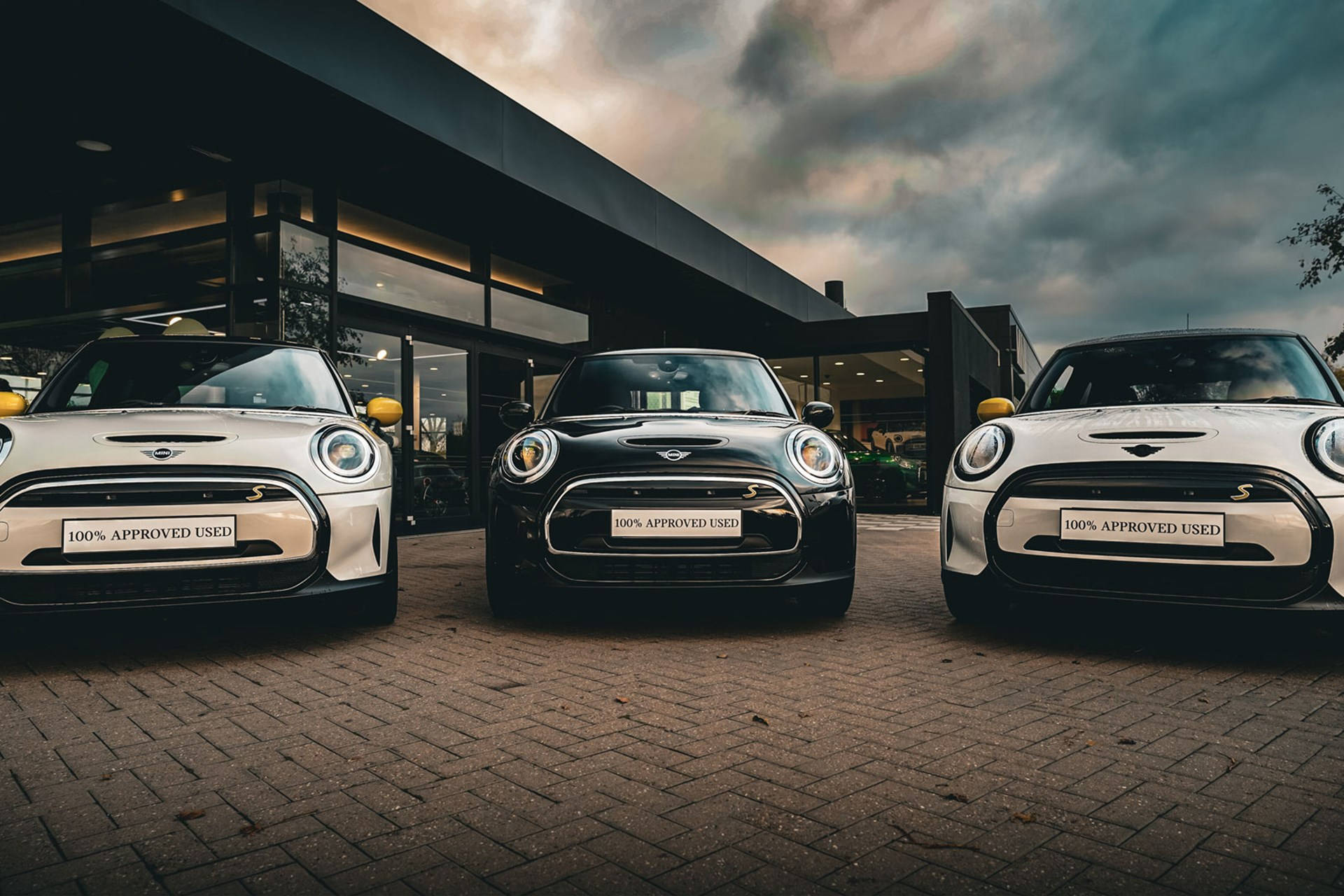 Mini Black And White Cars Outside Building