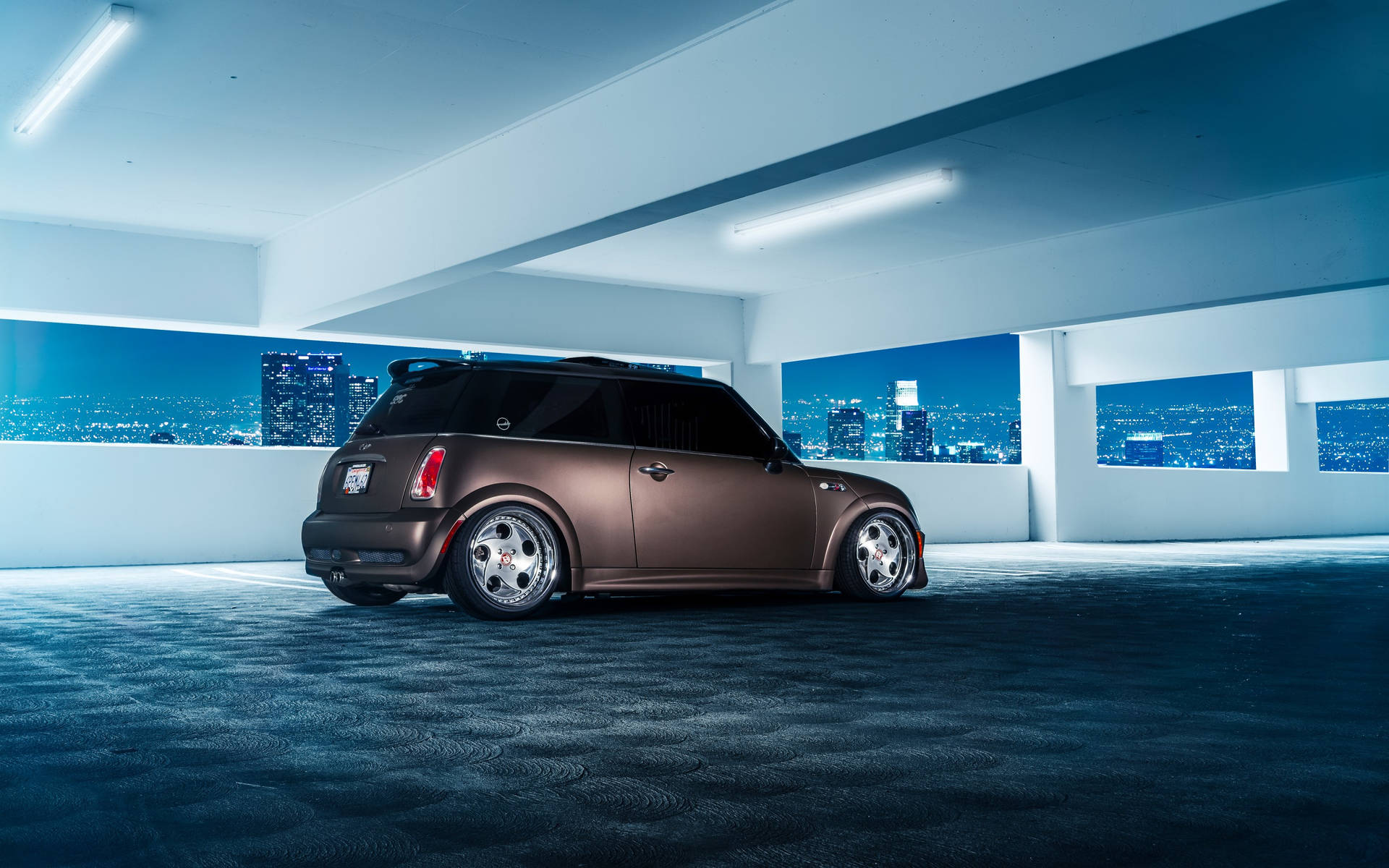 Mini Cooper In Elevated Parking Space Background