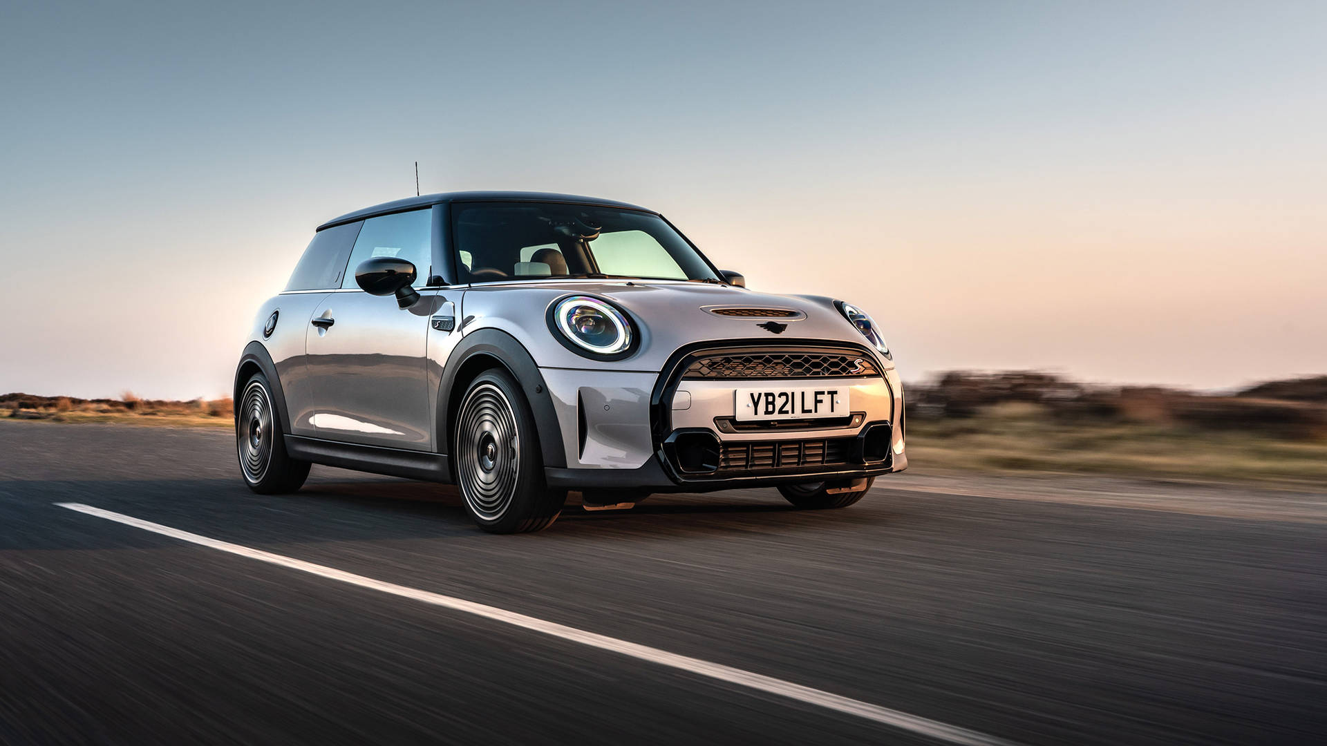 Mini Gray Car Under Sunset Background