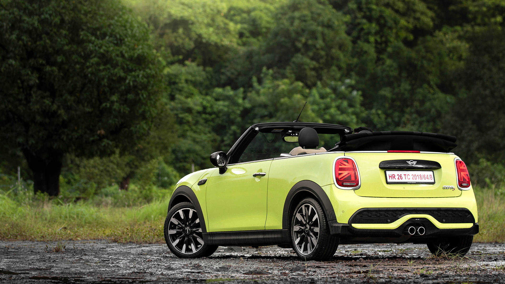 Mini Neon Green Car In Forest Background