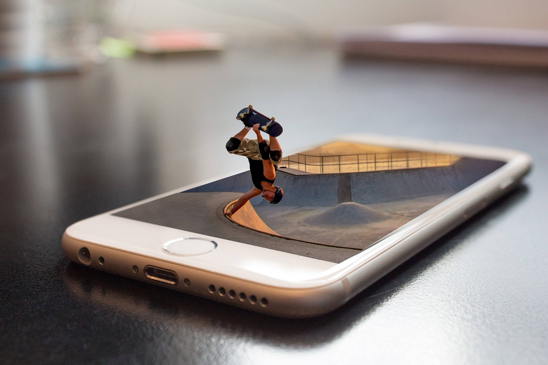 Mini Skateboarder On Mobile Phone