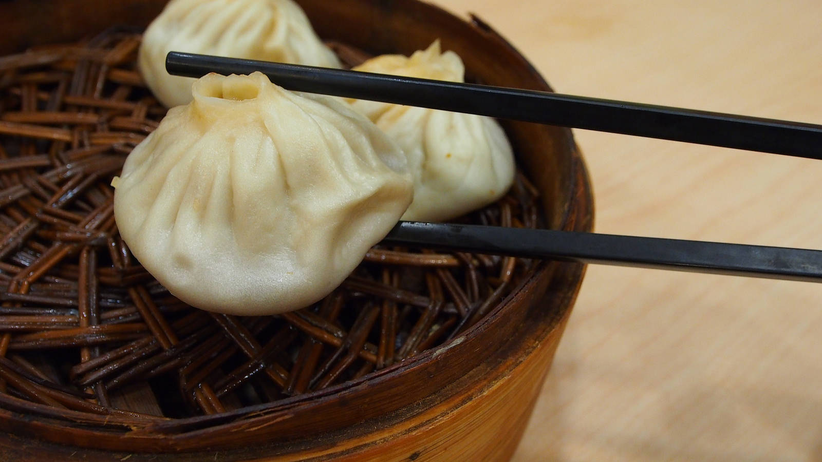 Mini Xiaolongbao With Black Chopsticks Background