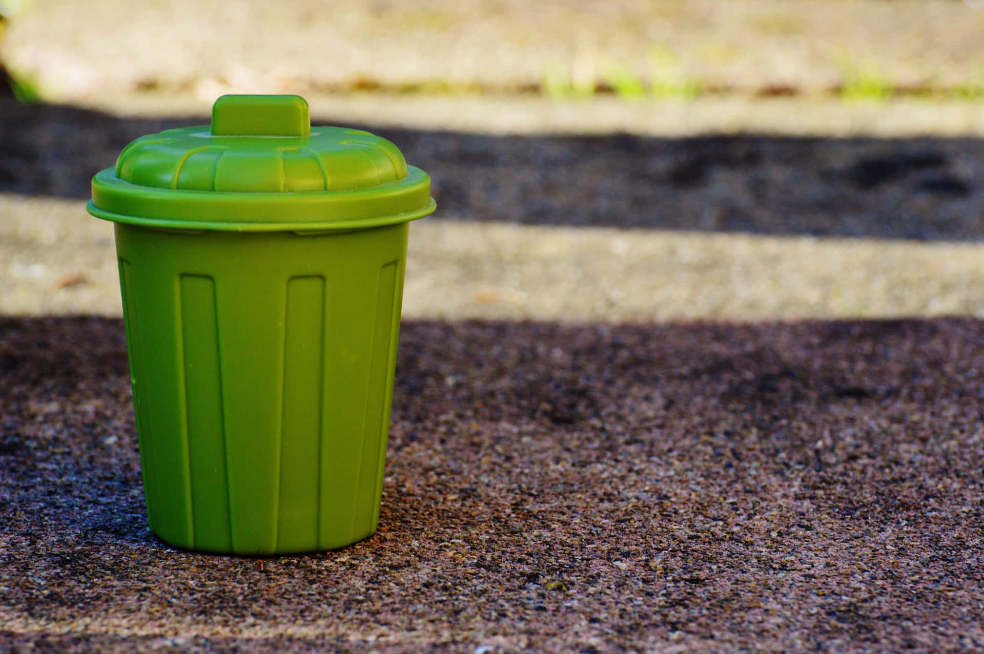 Miniature Green Trash Can With Lid Background