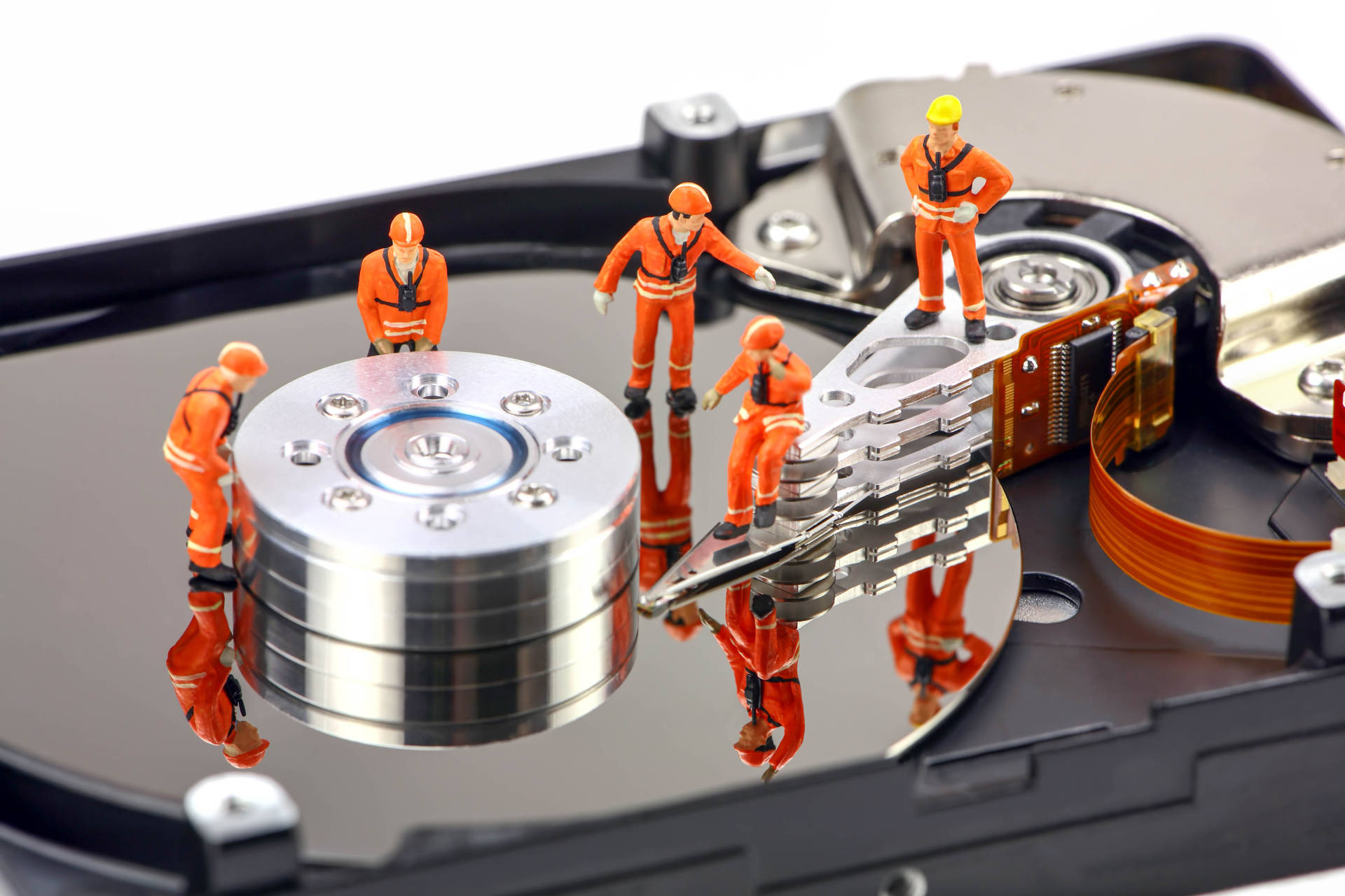 Miniature Workers Repairing Hard Drive Disk Background