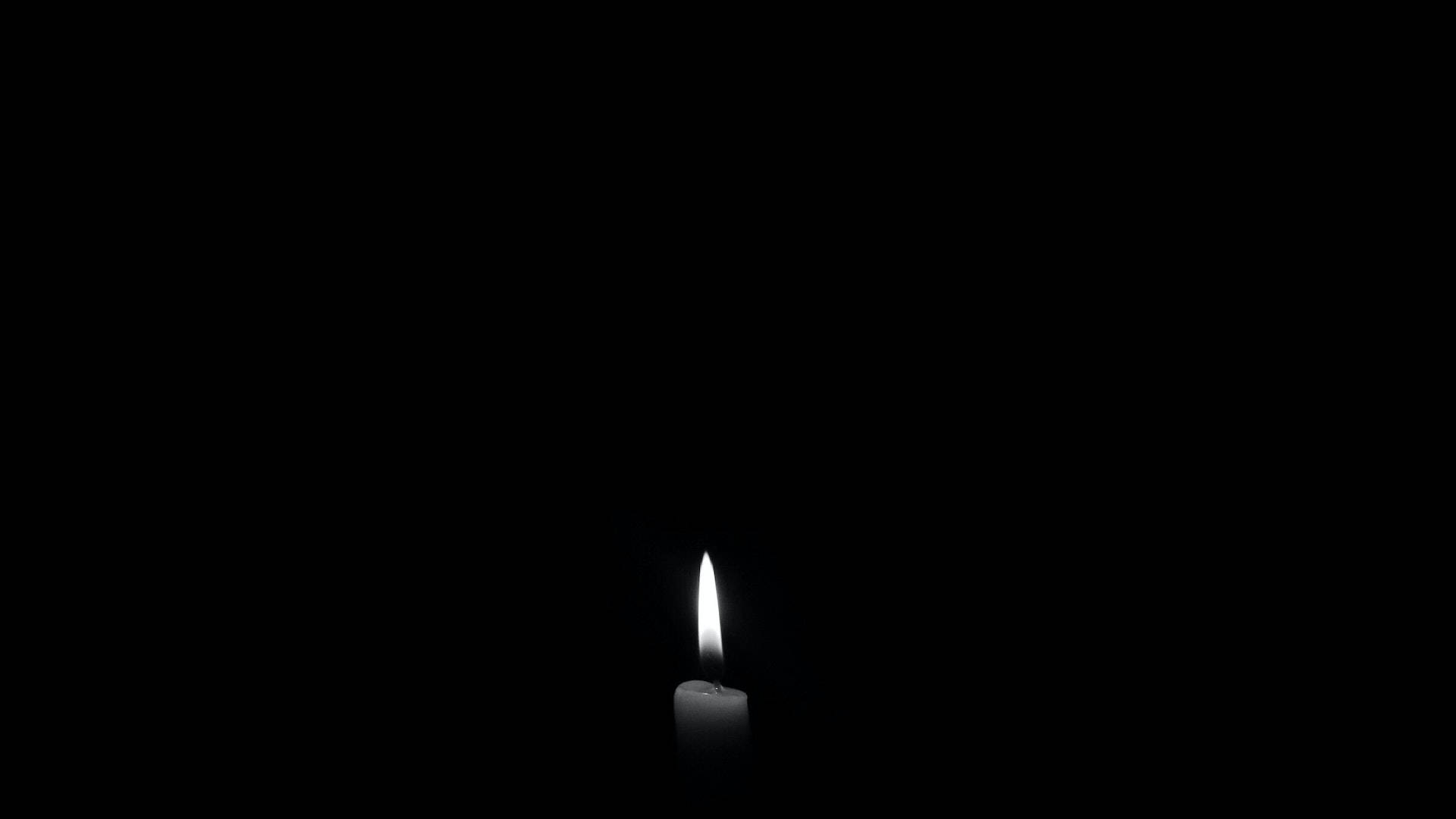 Minimalist Candle On Black Desktop Background