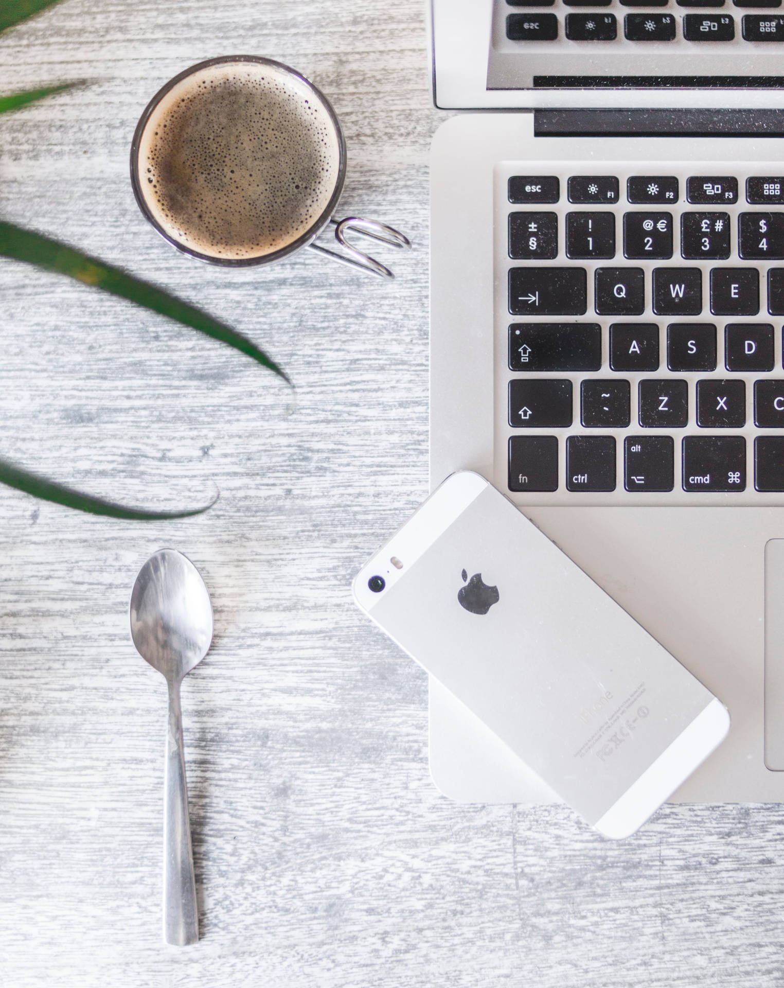 Minimalist Iphone Desk With Silver Spoon