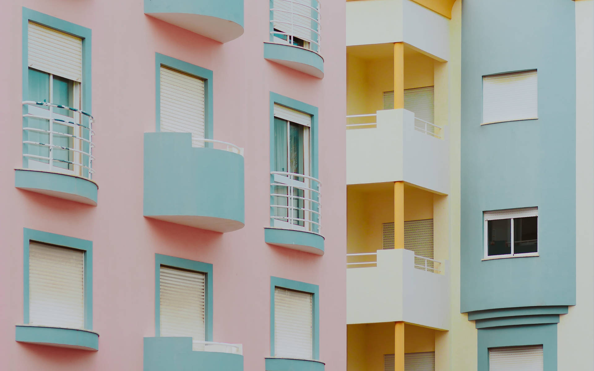 Minimalist Residential Buildings In Pastel Colors Background