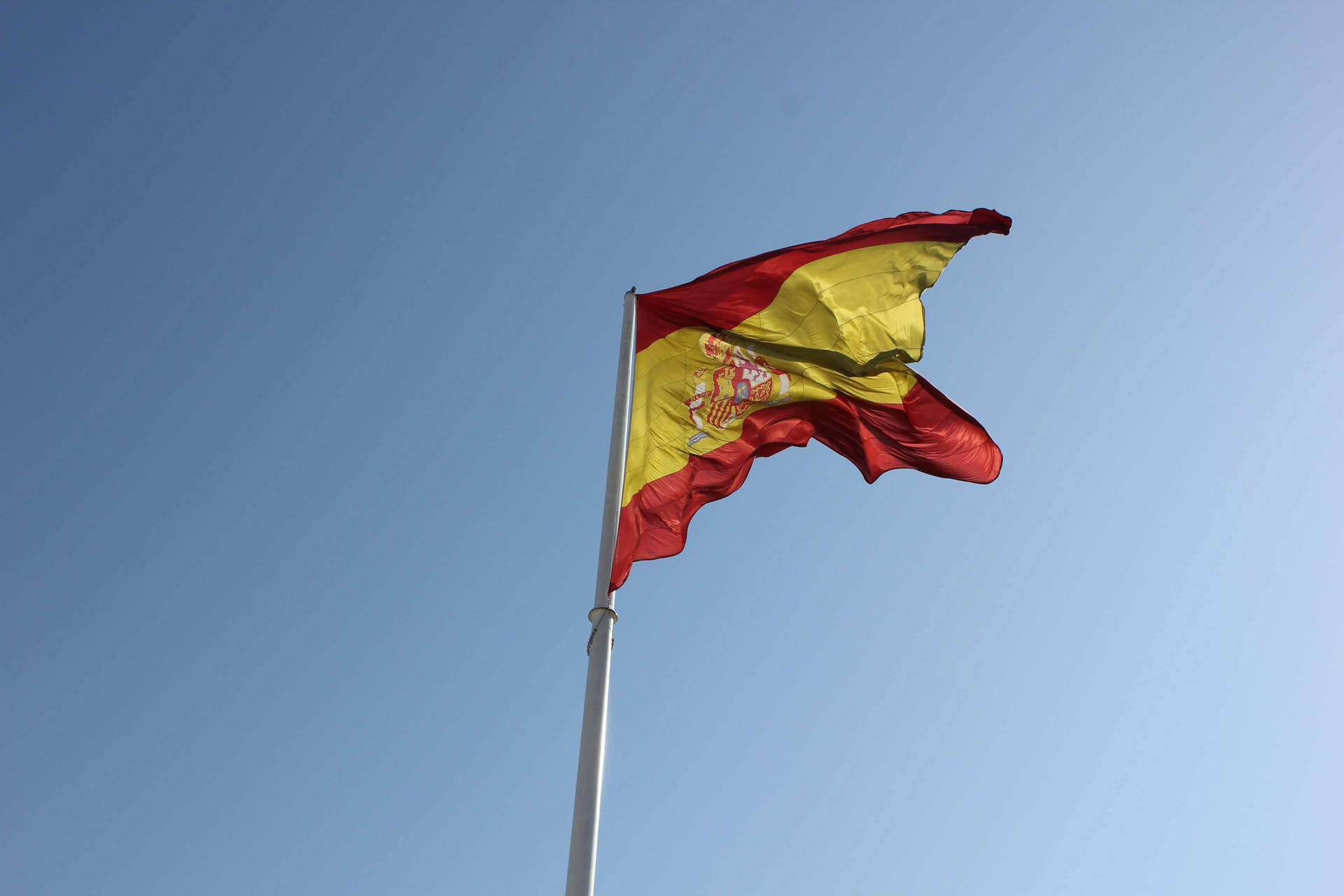Minimalist Spain Flag Flying Background