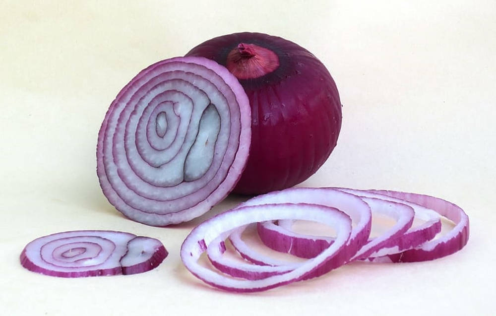 Minimalistic Chopped Red Onion Rings Background