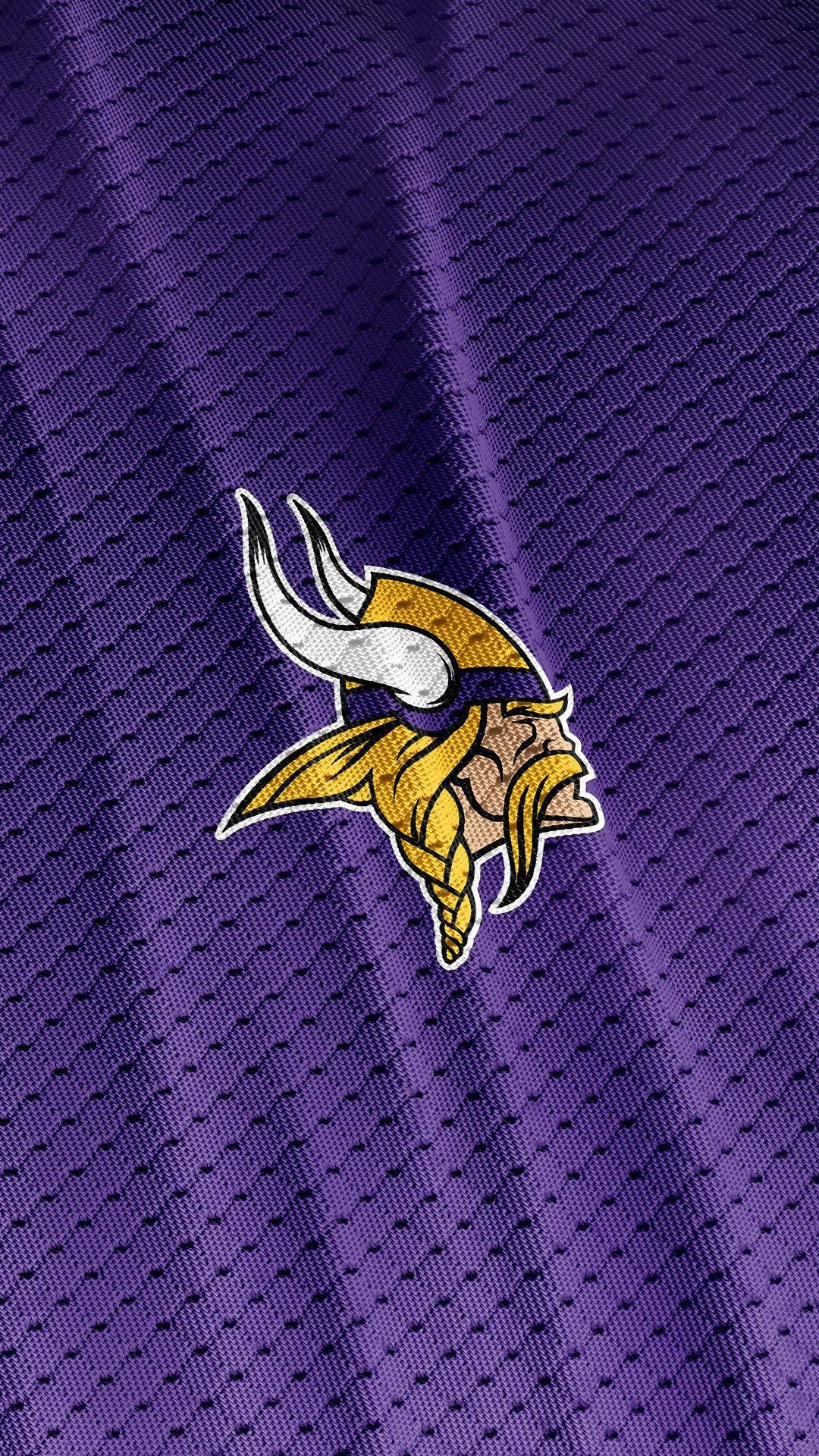 Minnesota Vikings Logo On Purple Jersey Background