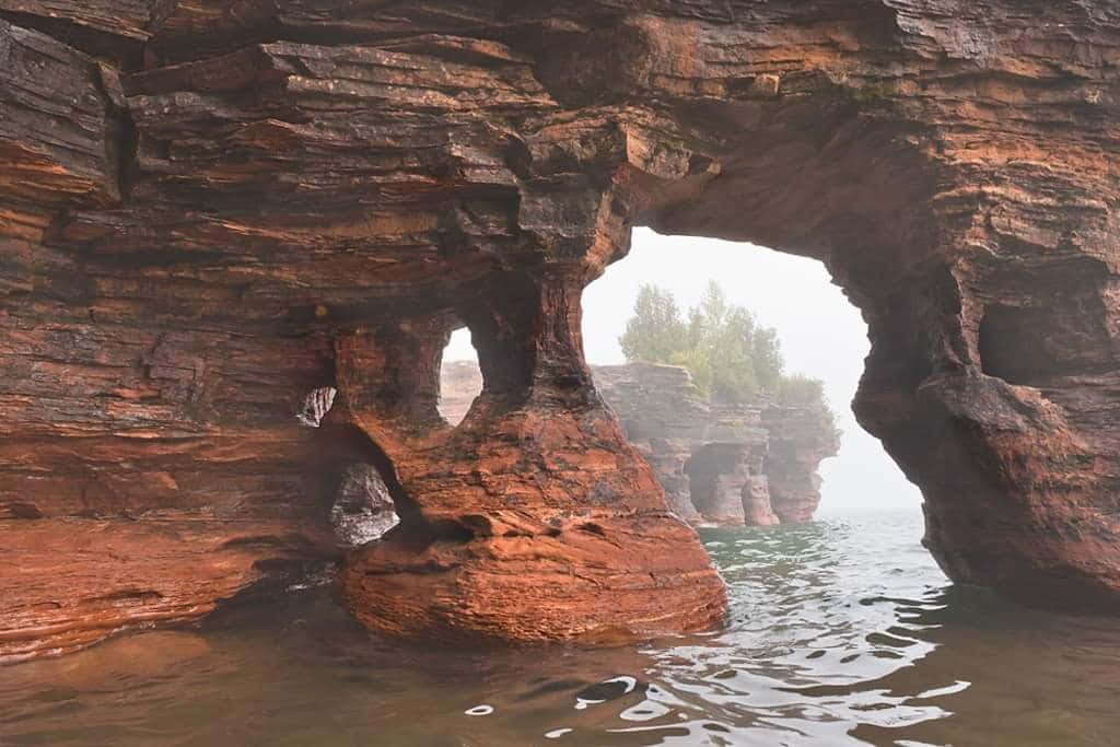 Misty_ Sea_ Arches_ Formation Background