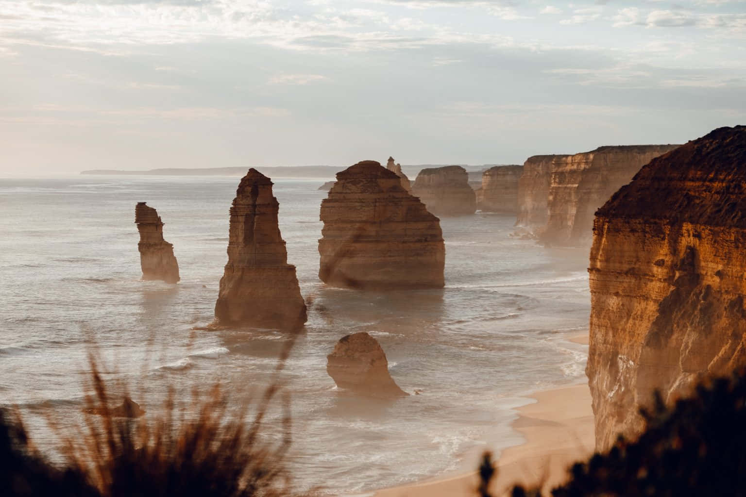 Misty Twelve Apostles In Victoria Australia Background