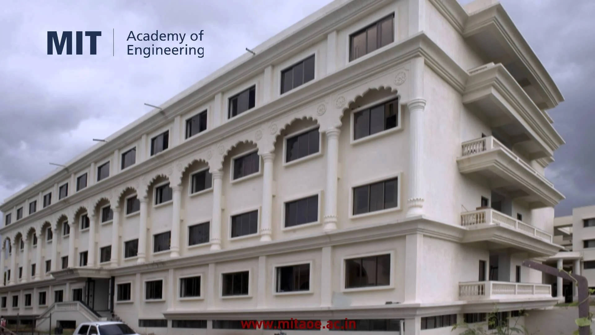 Mit Building Under Cloudy Sky Background