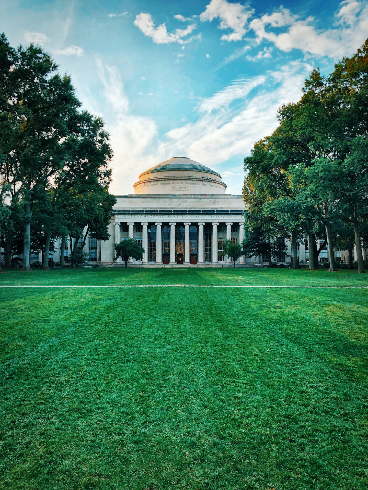 Mit Great Dome With Grass And Trees Background