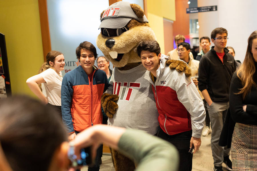 Mit Students Posing With College Mascot Background