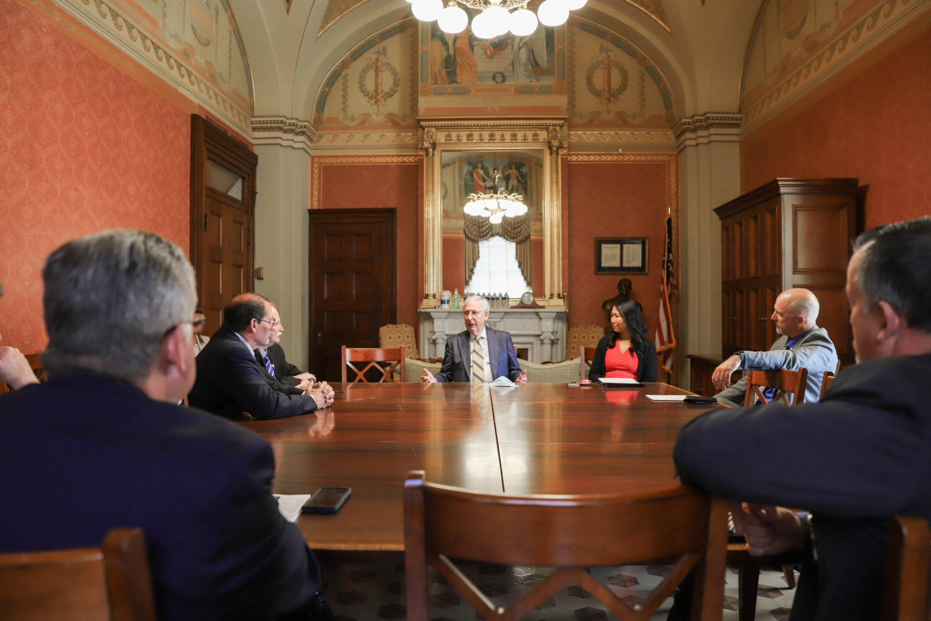 Mitch Mcconnell At Conference Table In Oval Office Background