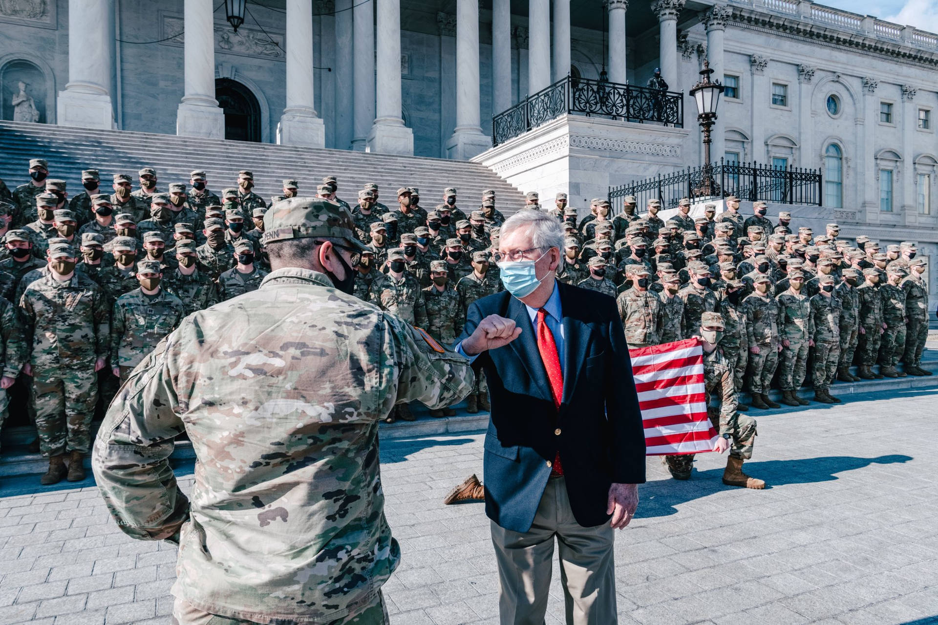 Mitch Mcconnell Elbow-bumping A Soldier Background