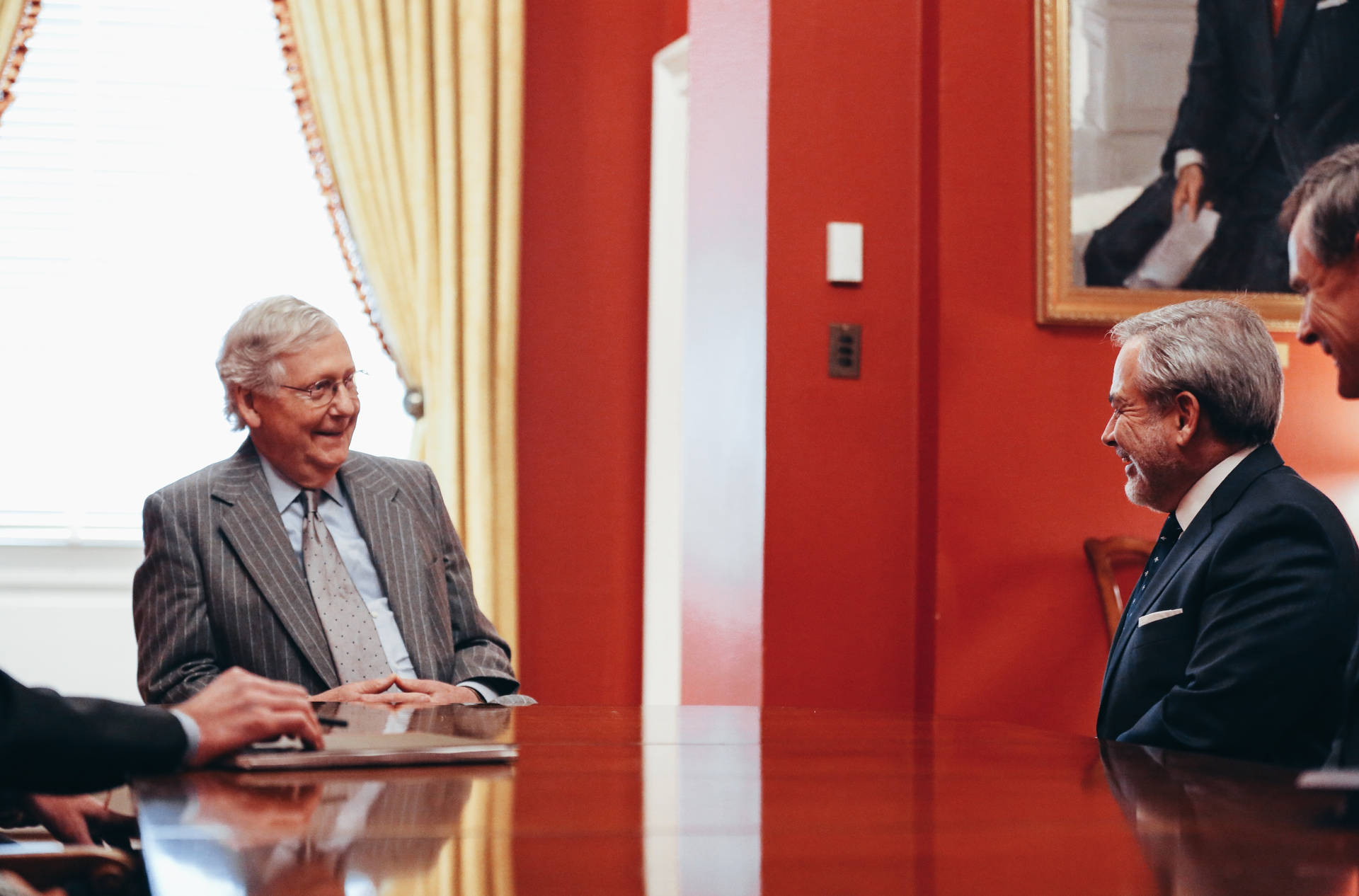 Mitch Mcconnell In Room With Red Paint Background