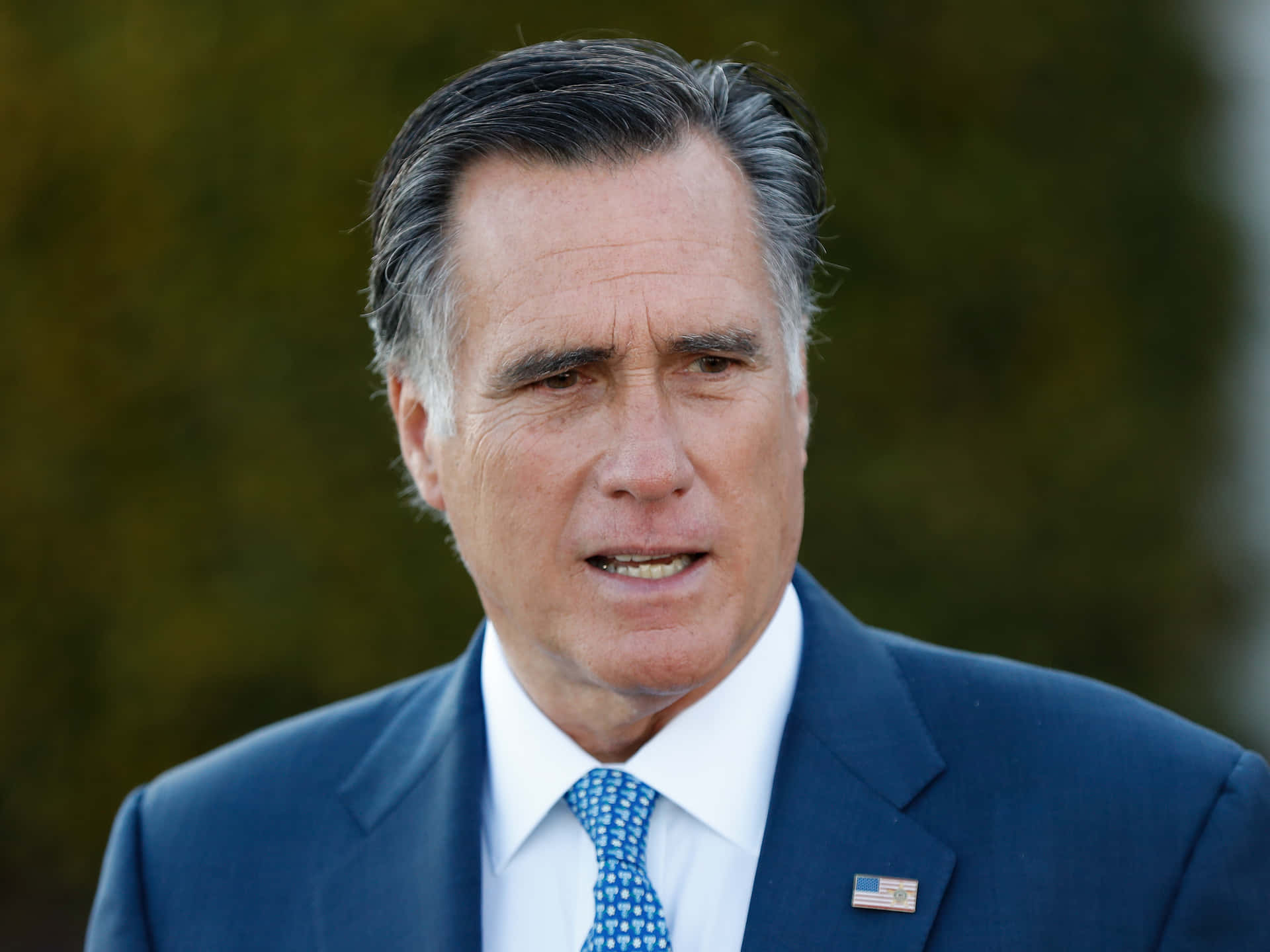 Mitt Romney Speaking Outdoors Background