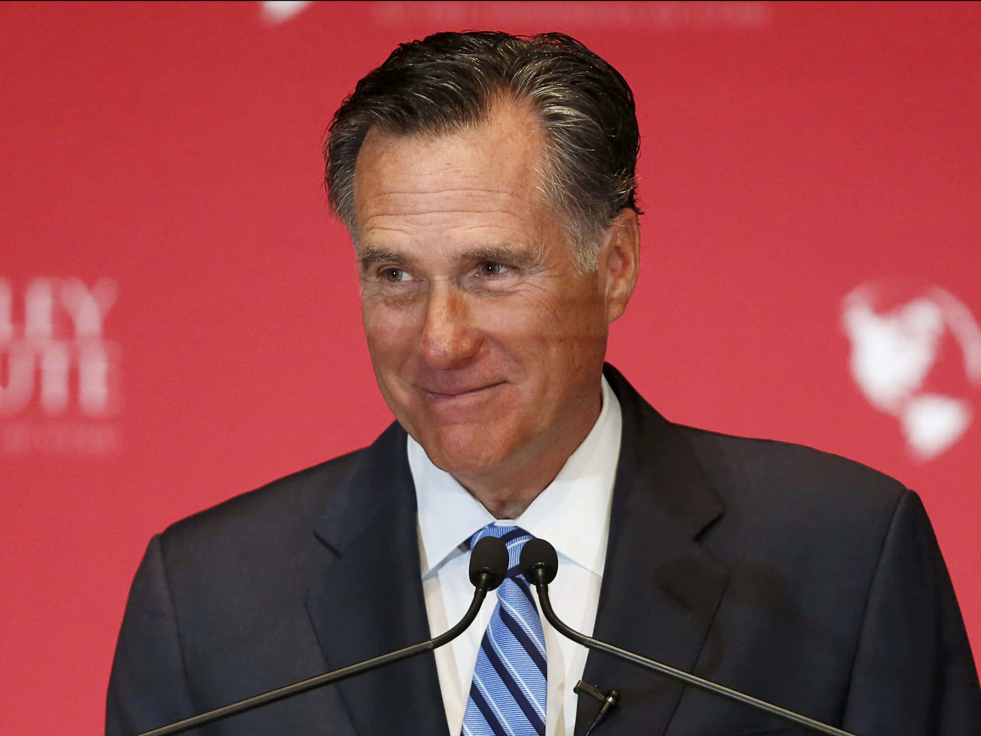 Mitt Romney Speakingat Podium Background