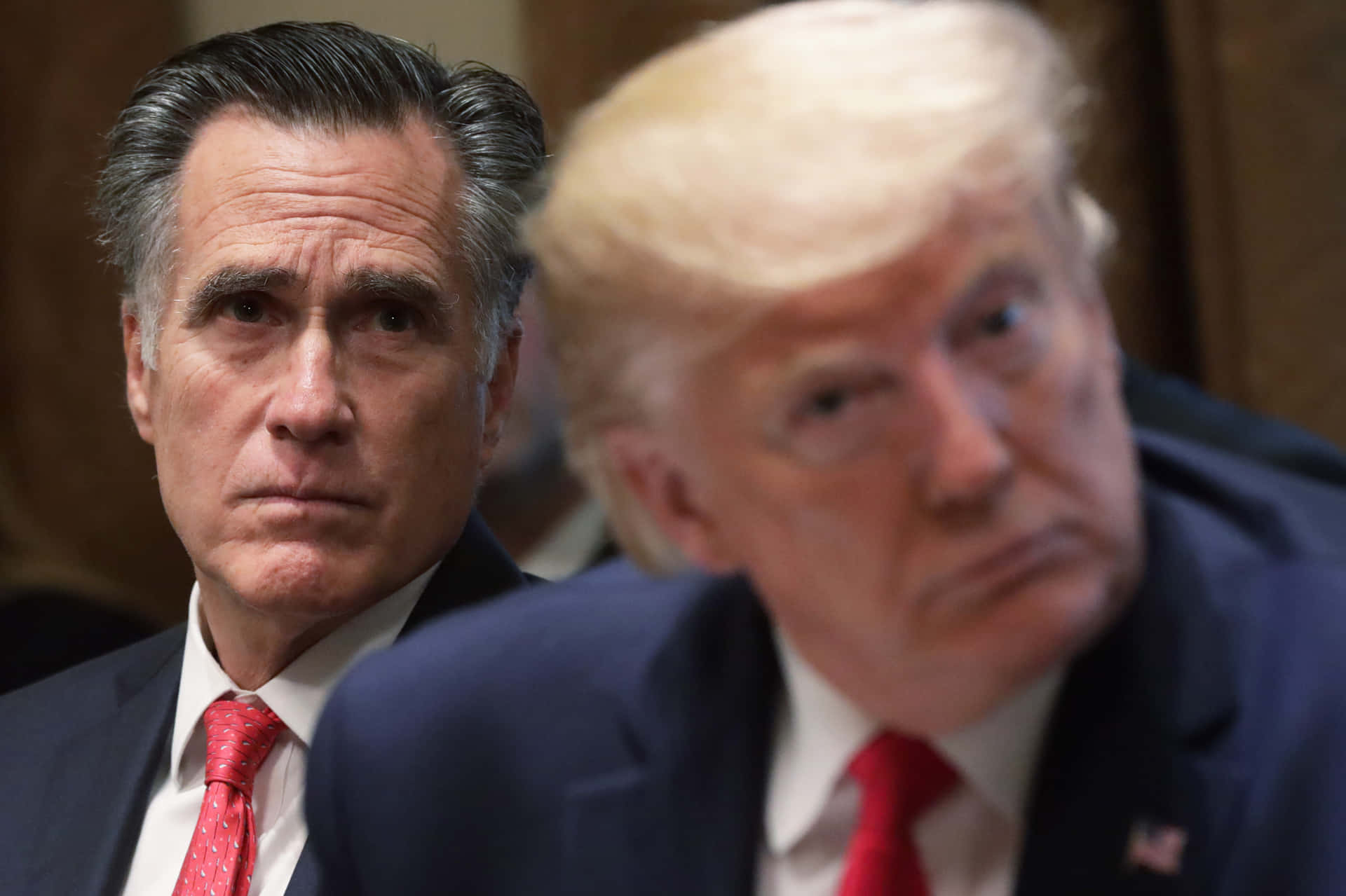 Mitt Romneyand Donald Trumpin Discussion Background