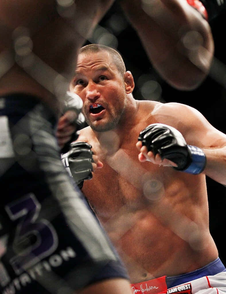 Mixed Martial Artist Dan Henderson Preparing Uppercut Background