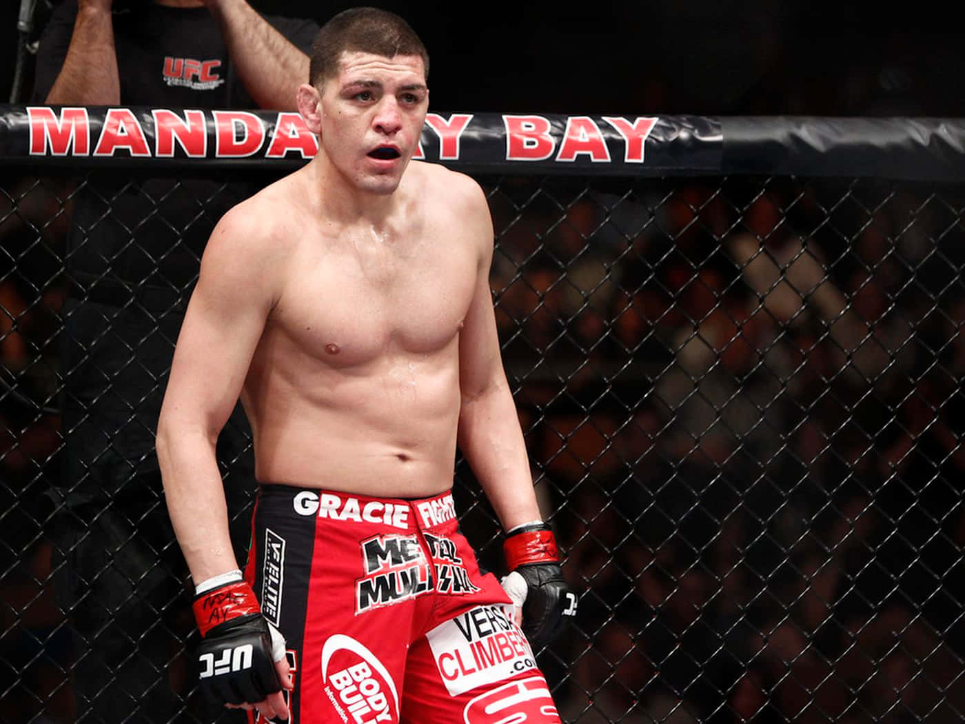 Mixed Martial Artist Nick Diaz In The Middle Of A Fight Background