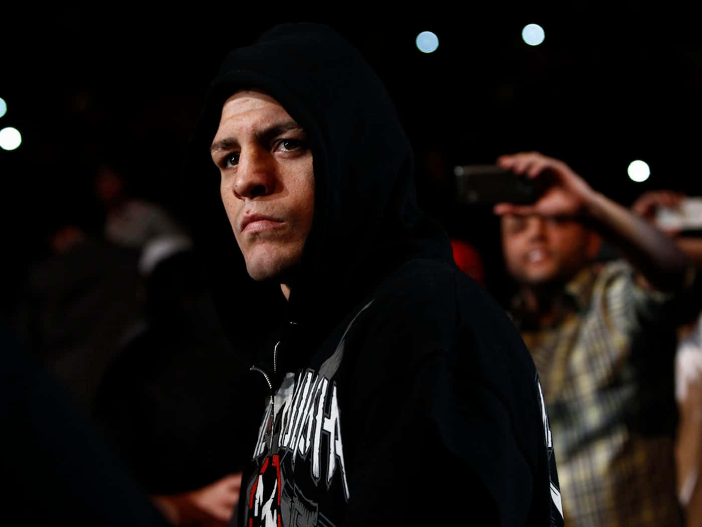 Mixed Martial Artist Nick Diaz With A Hoodie On Background