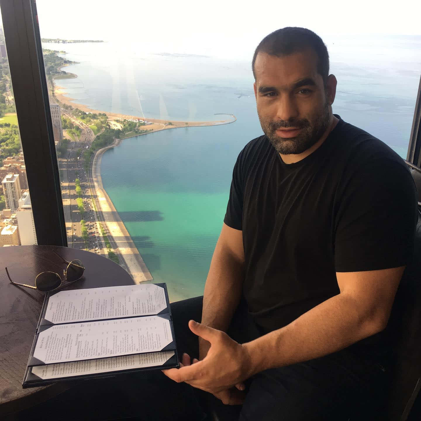 Mixed Martial Arts Fighter Blagoy Ivanov Enjoying Dinner At A Restaurant Background