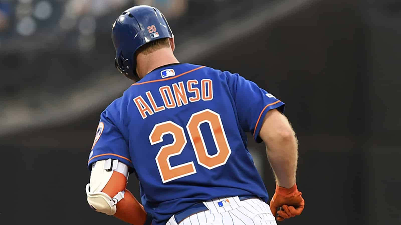 Mlb Rookie Pete Alonso Smiling After Batting Home Run Background