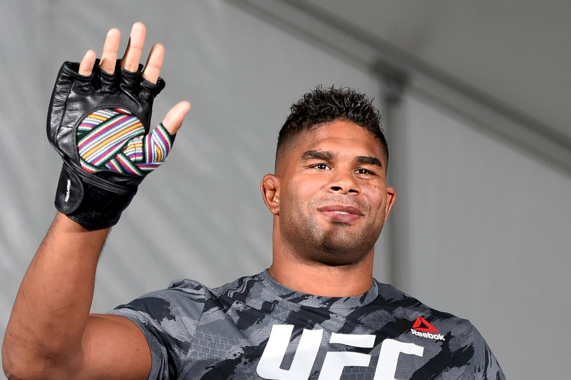 Mma Fighter Alistair Overeem Waving Background