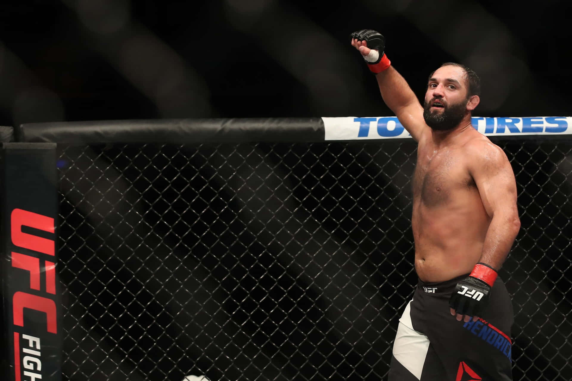 Mma Fighter Johny Hendricks Raising His Fist In Celebration