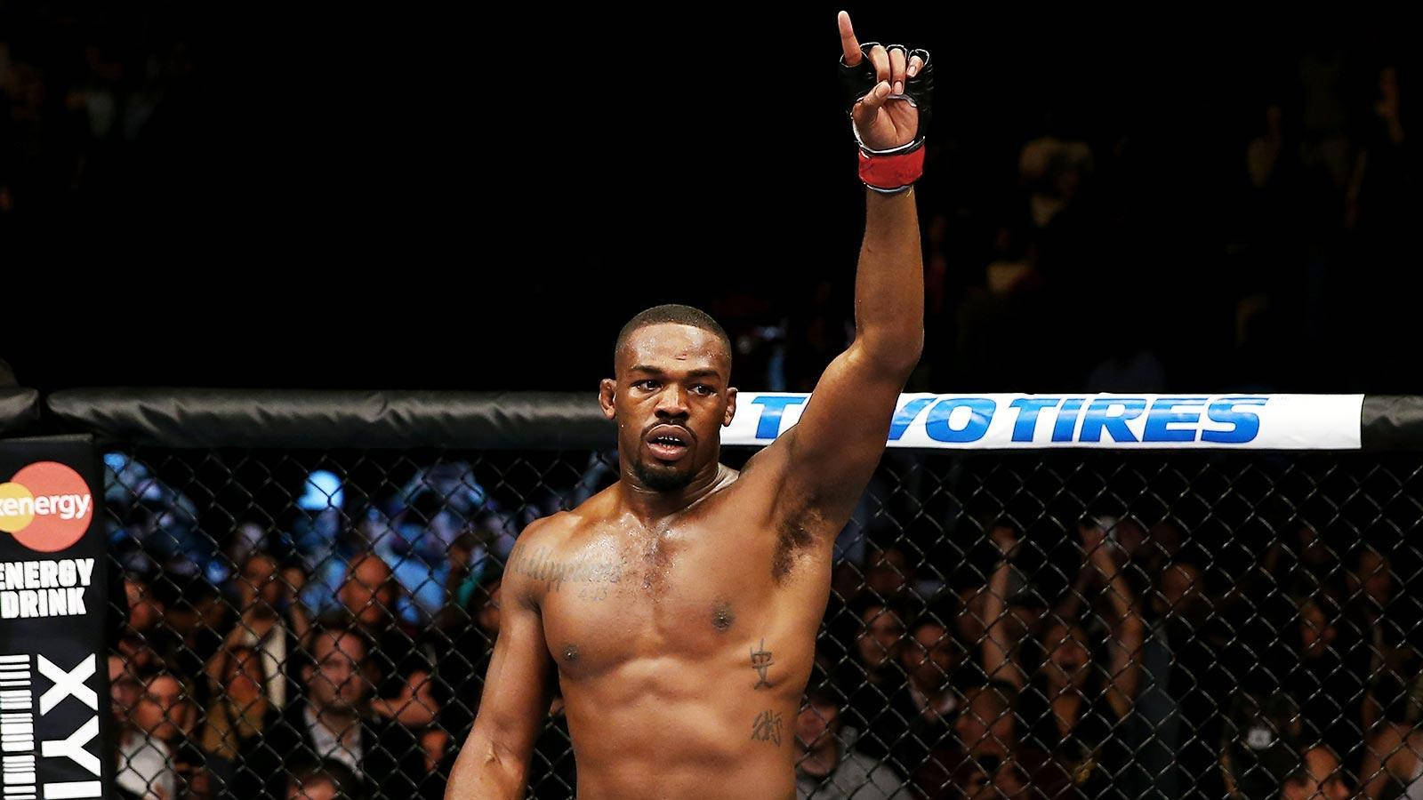 Mma Fighter Jon Jones Raising Finger Background